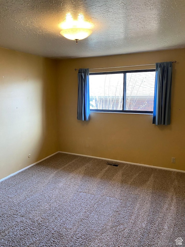2547 E 1900 N, Layton, UT 84040 - spare room featuring carpet floors, baseboards, visible vents, and a textured ceiling