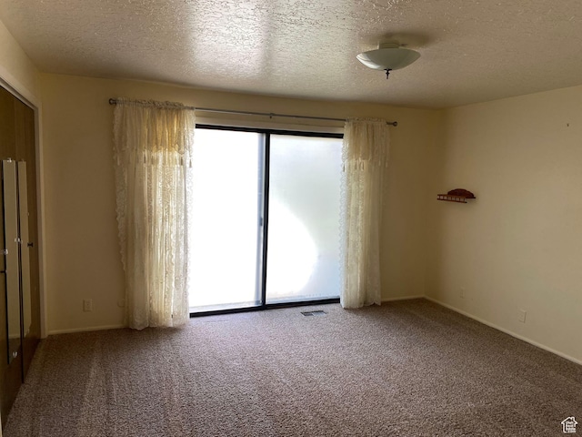 2547 E 1900 N, Layton, UT 84040 - spare room featuring carpet flooring, visible vents, a textured ceiling, and baseboards