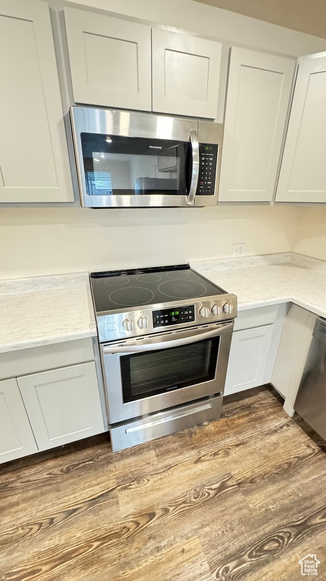 383 W 625 N A-D, Unit A-D Payson, UT 84651 - kitchen with white cabinets, light countertops, appliances with stainless steel finishes, and dark wood-style floors