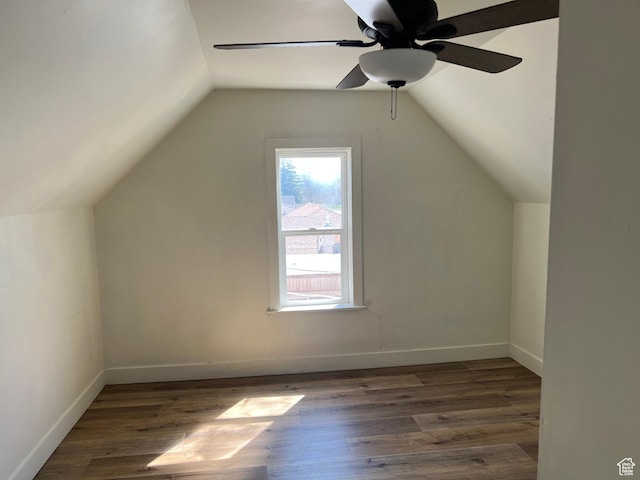 additional living space featuring ceiling fan, baseboards, wood finished floors, and lofted ceiling