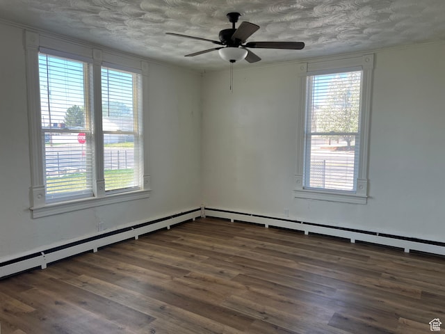 empty room featuring crown molding, a healthy amount of sunlight, wood finished floors, and a ceiling fan