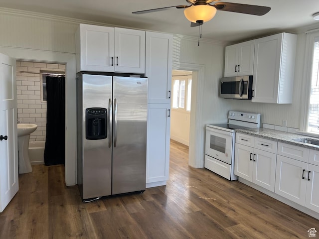 kitchen with white cabinetry, a ceiling fan, and stainless steel appliances