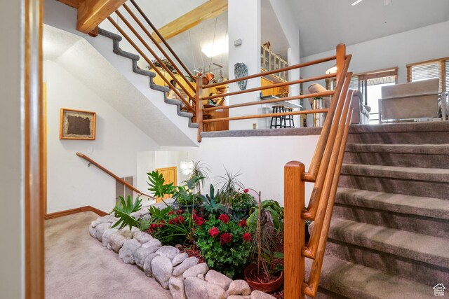 4042 Saddleback Rd, Park City, UT 84098 - stairs with carpet floors, baseboards, and a high ceiling