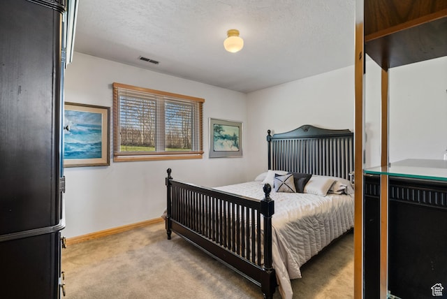 4042 Saddleback Rd, Park City, UT 84098 - bedroom featuring baseboards, light carpet, a textured ceiling, freestanding refrigerator, and visible vents
