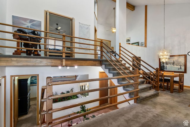 4042 Saddleback Rd, Park City, UT 84098 - staircase featuring carpet floors, high vaulted ceiling, beam ceiling, and ceiling fan with notable chandelier