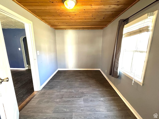 30028 Old Lincoln Hwy, Wanship, UT 84017 - empty room featuring baseboards, crown molding, arched walkways, wood ceiling, and wood finished floors