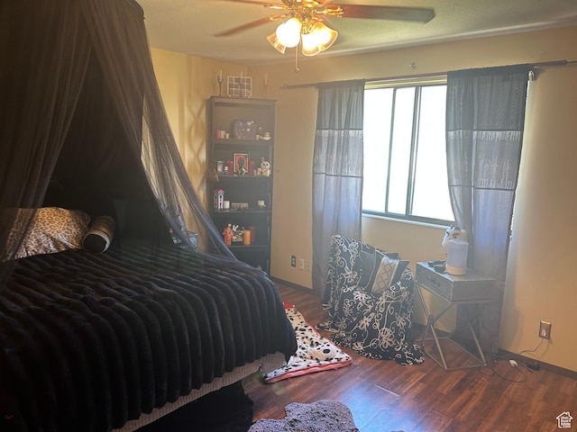 281 E 7th St S, Ogden, UT 84404 - bedroom with visible vents, baseboards, a ceiling fan, and wood finished floors