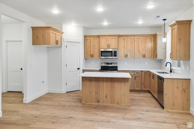 1284 E 1150 S, Garland, UT 84312 - kitchen with a center island, light countertops, a sink, and appliances with stainless steel finishes