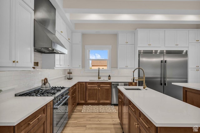 1816 S 920 W, Hurricane, UT 84737 - kitchen with a sink, wall chimney range hood, light wood-type flooring, and stainless steel appliances