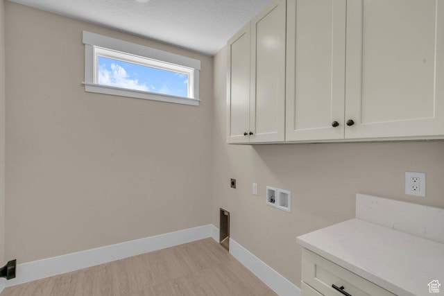 1816 S 920 W, Hurricane, UT 84737 - laundry area featuring hookup for an electric dryer, washer hookup, light wood finished floors, baseboards, and cabinet space