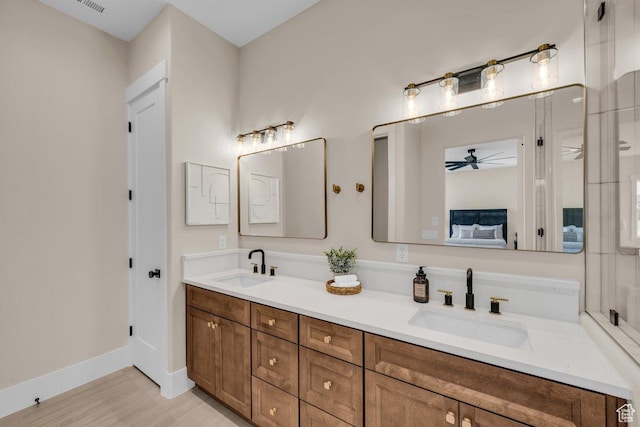 1816 S 920 W, Hurricane, UT 84737 - bathroom featuring double vanity, a sink, a ceiling fan, and ensuite bath