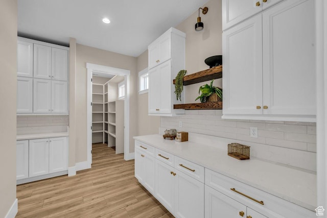 1816 S 920 W, Hurricane, UT 84737 - kitchen with tasteful backsplash, light wood finished floors, open shelves, and white cabinets