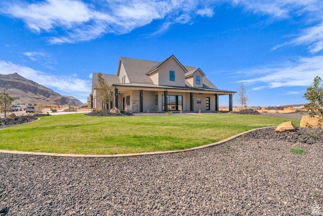 1816 S 920 W, Hurricane, UT 84737 - rear view of property with a mountain view, stone siding, and a lawn