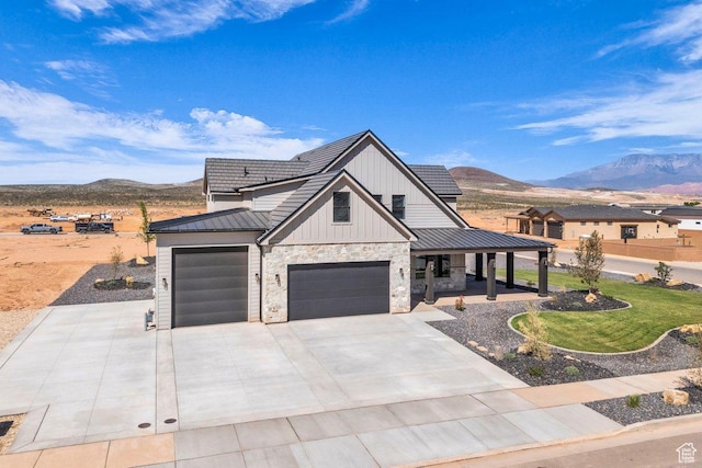 1816 S 920 W, Hurricane, UT 84737 - modern farmhouse style home with a mountain view, board and batten siding, a porch, a standing seam roof, and metal roof