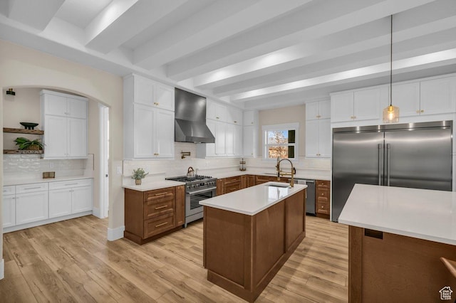 1816 S 920 W, Hurricane, UT 84737 - kitchen featuring wall chimney range hood, light countertops, high end appliances, beamed ceiling, and decorative backsplash