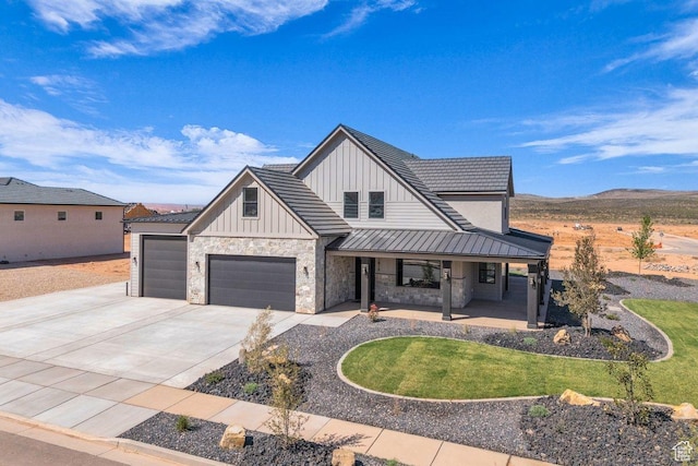1816 S 920 W, Hurricane, UT 84737 - modern farmhouse featuring concrete driveway, board and batten siding, stone siding, a garage, and covered porch