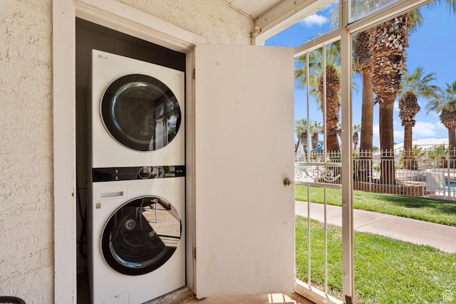 laundry room featuring laundry area and stacked washer and dryer