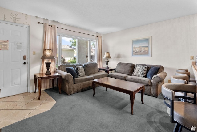 living room with light tile patterned flooring, wallpapered walls, and light carpet