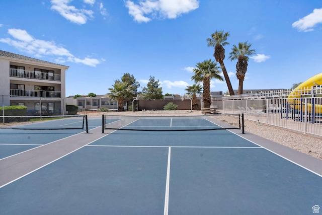 view of tennis court with fence