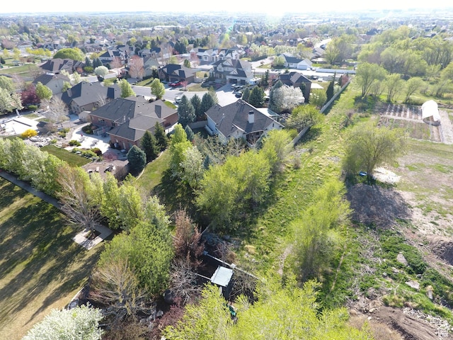 birds eye view of property with a residential view