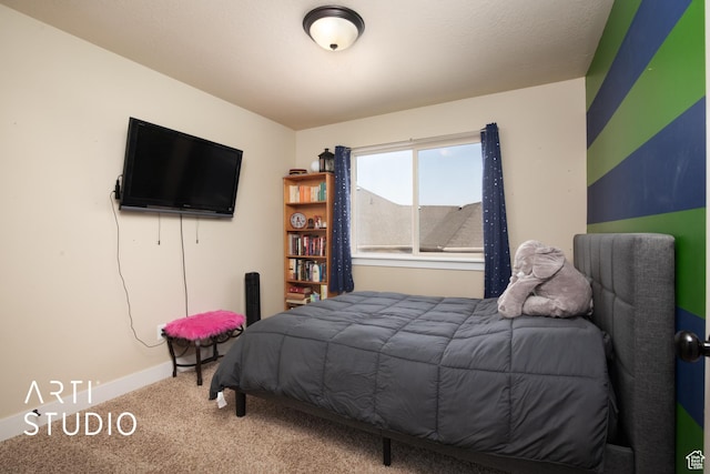 bedroom with carpet flooring and baseboards