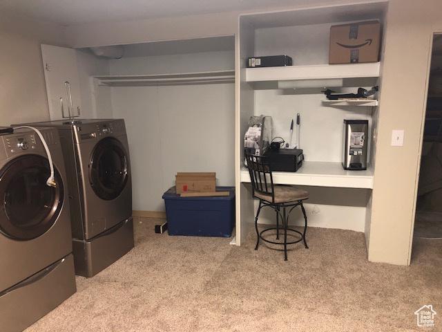 laundry room featuring carpet, separate washer and dryer, and laundry area