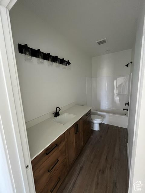 732 S 1140 E, Smithfield, UT 84335 - full bathroom featuring vanity, toilet, visible vents, wood finished floors, and  shower combination