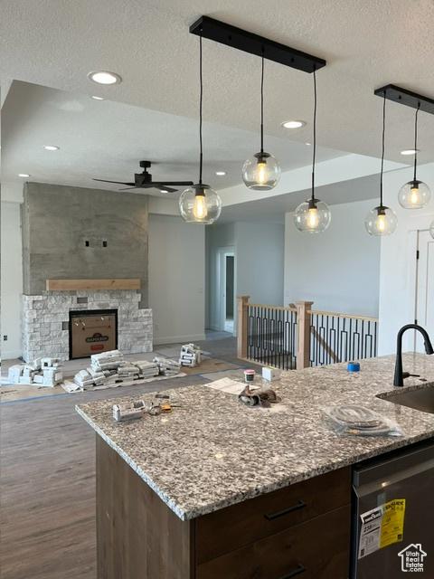 732 S 1140 E, Smithfield, UT 84335 - kitchen with dishwasher, a sink, a ceiling fan, a textured ceiling, and open floor plan
