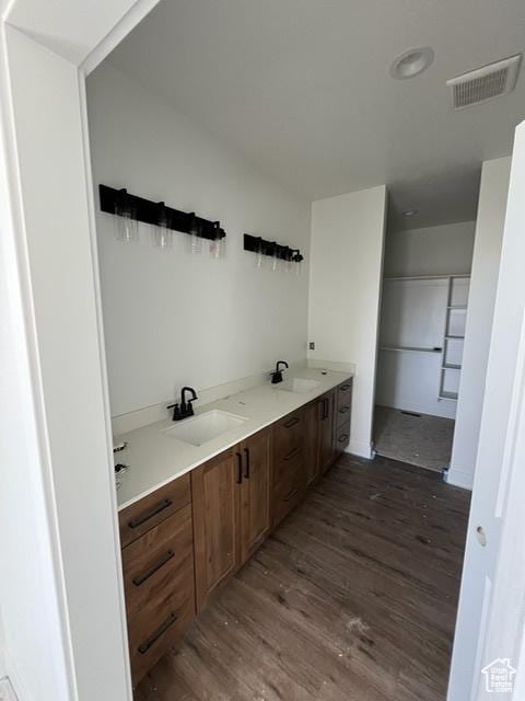 732 S 1140 E, Smithfield, UT 84335 - bathroom featuring double vanity, a sink, wood finished floors, and visible vents
