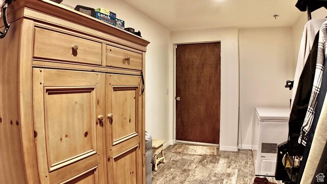 3193 S Southfield Rd W, Daniel, UT 84032 - interior space featuring light wood-type flooring, laundry area, and baseboards