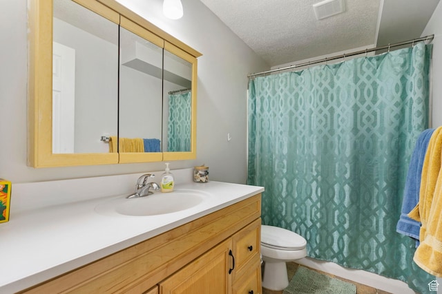 1055 W 325 N, Hyrum, UT 84319 - full bathroom featuring visible vents, toilet, vanity, and a textured ceiling