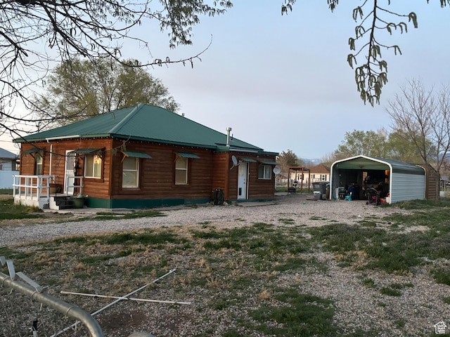 80 N 100 W, Redmond, UT 84652 - view of side of home with a detached carport and metal roof