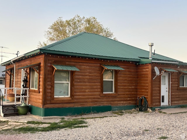 80 N 100 W, Redmond, UT 84652 - view of side of home featuring metal roof and faux log siding