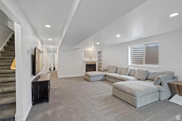 956 S 1525 W, Syracuse, UT 84075 - carpeted living area with recessed lighting, stairway, a tile fireplace, and baseboards