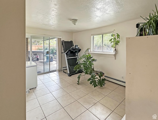 interior space featuring a baseboard radiator, plenty of natural light, and light tile patterned floors