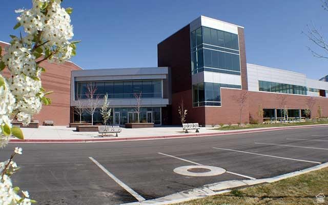 view of building exterior featuring uncovered parking