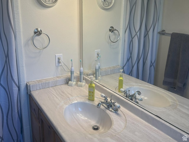 bathroom with vanity and a shower with shower curtain