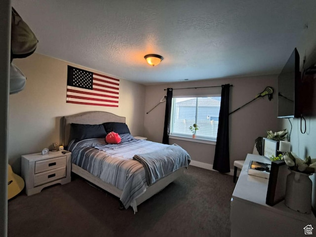 carpeted bedroom with a textured ceiling