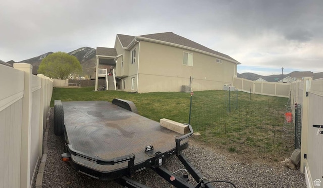 view of yard featuring a patio area and a fenced backyard