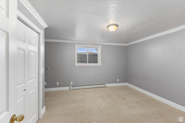 unfurnished bedroom with baseboards, carpet flooring, a baseboard heating unit, and a textured ceiling