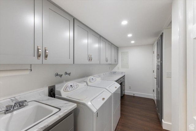 laundry room with recessed lighting, dark wood-style floors, independent washer and dryer, cabinet space, and a sink