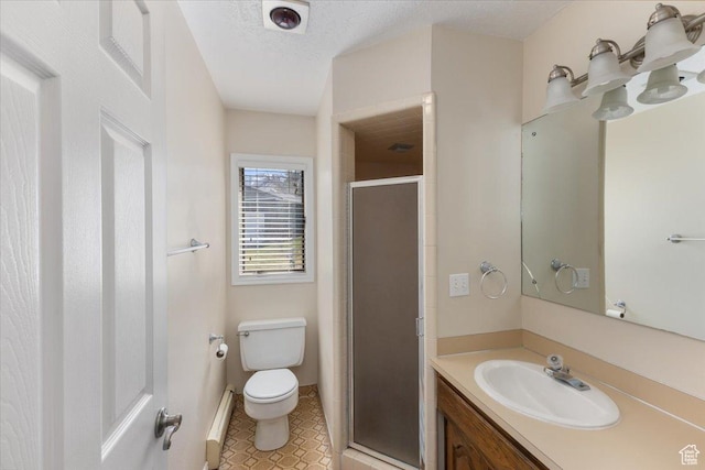 full bathroom with a baseboard heating unit, toilet, vanity, tile patterned flooring, and a stall shower