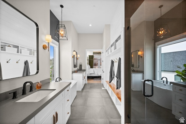 bathroom featuring vanity, recessed lighting, a freestanding tub, ensuite bathroom, and a stall shower