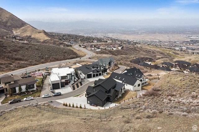 drone / aerial view with a residential view and a mountain view