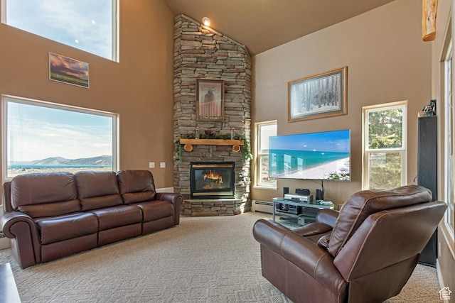 155 S Last Chance Dr, Laketown, UT 84038 - living area featuring a healthy amount of sunlight, high vaulted ceiling, a stone fireplace, and carpet floors