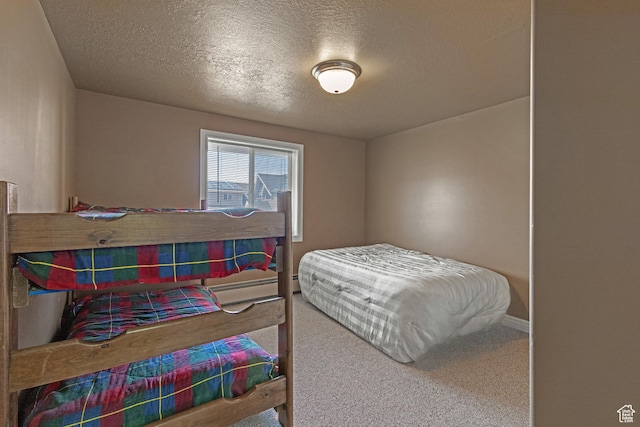 155 S Last Chance Dr, Laketown, UT 84038 - carpeted bedroom featuring baseboards and a textured ceiling