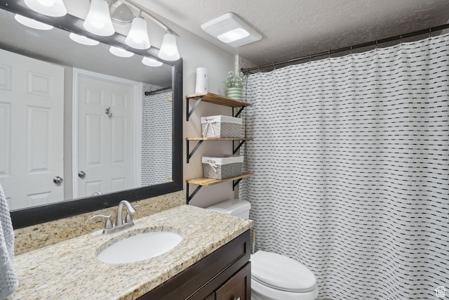full bath featuring a shower with shower curtain, a textured ceiling, toilet, and vanity