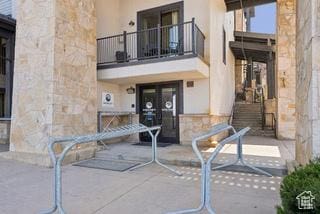 2669 Canyons Resort Dr Unit 207, Park City, UT 84098 - doorway to property with stucco siding, stone siding, and a balcony