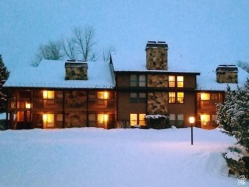 3615 N Wolf Lodge Dr Unit 211, Eden, UT 84310 - snow covered property with a chimney