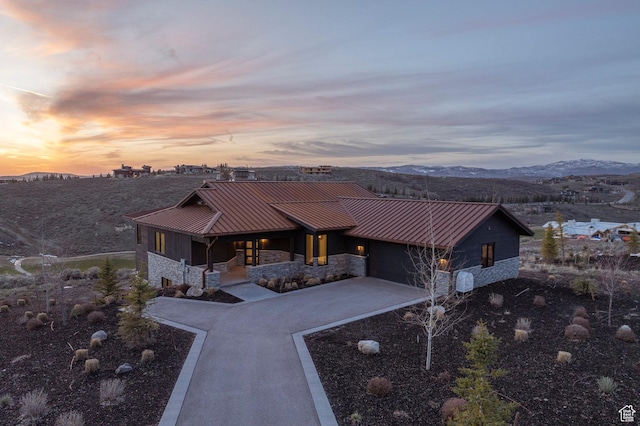 6633 Golden Bear Loop W, Park City, UT 84098 - view of front of home featuring concrete driveway, a standing seam roof, metal roof, and stone siding